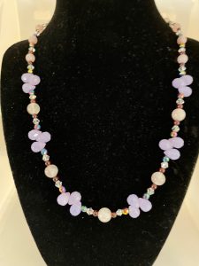 Violet Chalcedony, Rose Quartz, and Garnet Necklace

This necklace promotes emotional stability, prosperity, and divine connection.