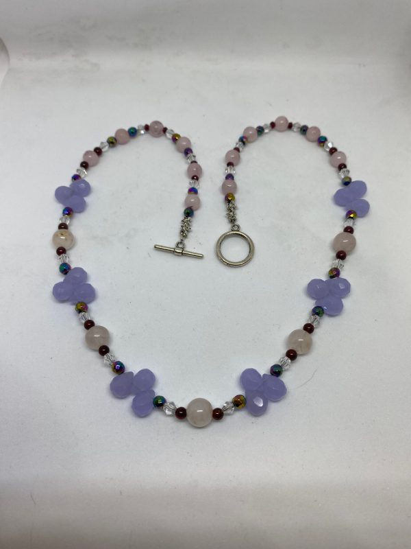 Violet Chalcedony, Rose Quartz, and Garnet Necklace This necklace promotes emotional stability, prosperity, and divine connection.