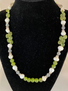 Peridot, Pearl, and Labradorite Necklace.

This necklace promotes Prosperity, Tranquility, and Protection. 