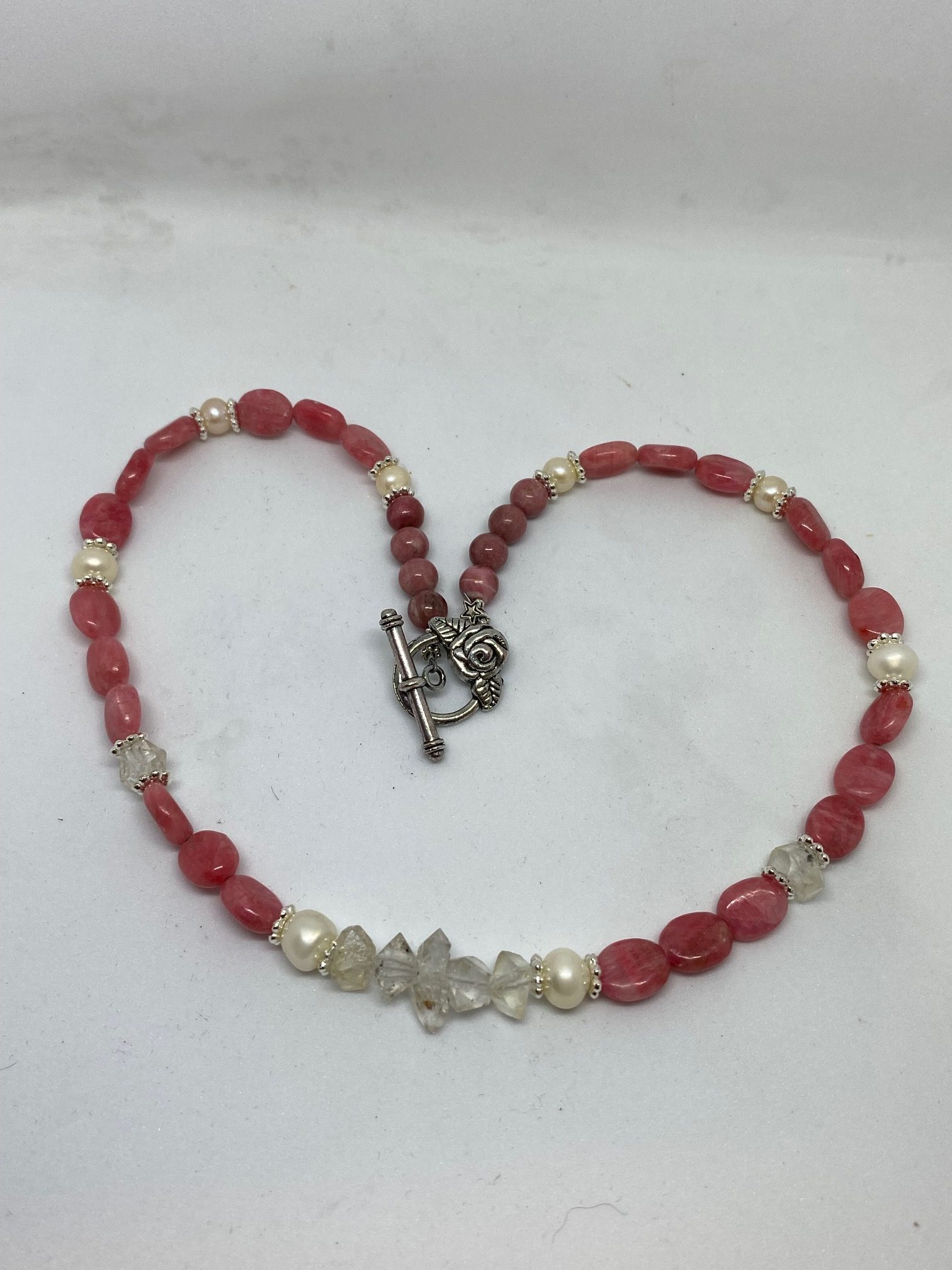 Rhodochrosite, Pearl, and Herkimer Diamond Necklace This necklace promotes Joy, Tranquility, and Bliss.