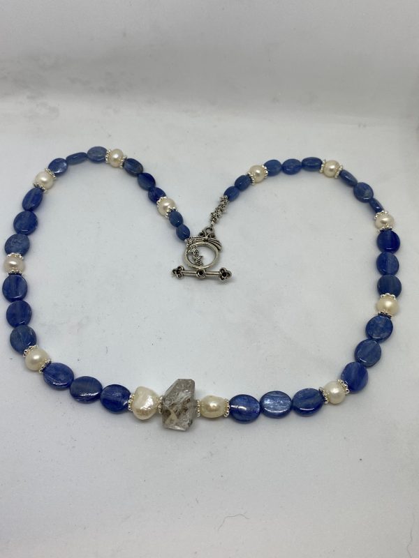 Blue Kyanite, Herkimer Diamond, and Pearl Necklace This necklace promotes Empowerment on all levels, Bliss, and Tranquility.