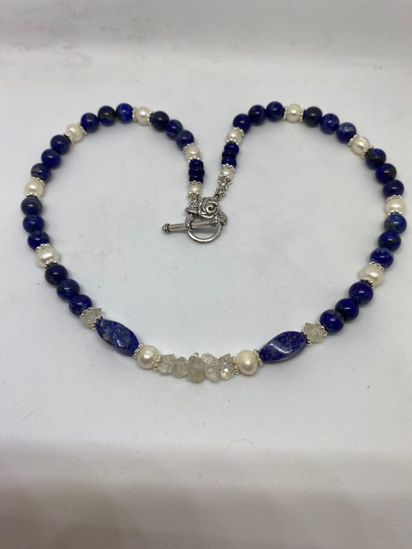 Lapis Lazuli, Herkimer Diamond, and Pearl Necklace. This necklace promotes Manifestation, Bliss, and Wisdom. 