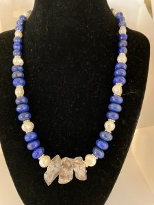 Lapis Lazuli, Herkimer Diamond, and Pearl Necklace.

This necklace promotes Manifestation, Bliss, and Wisdom.