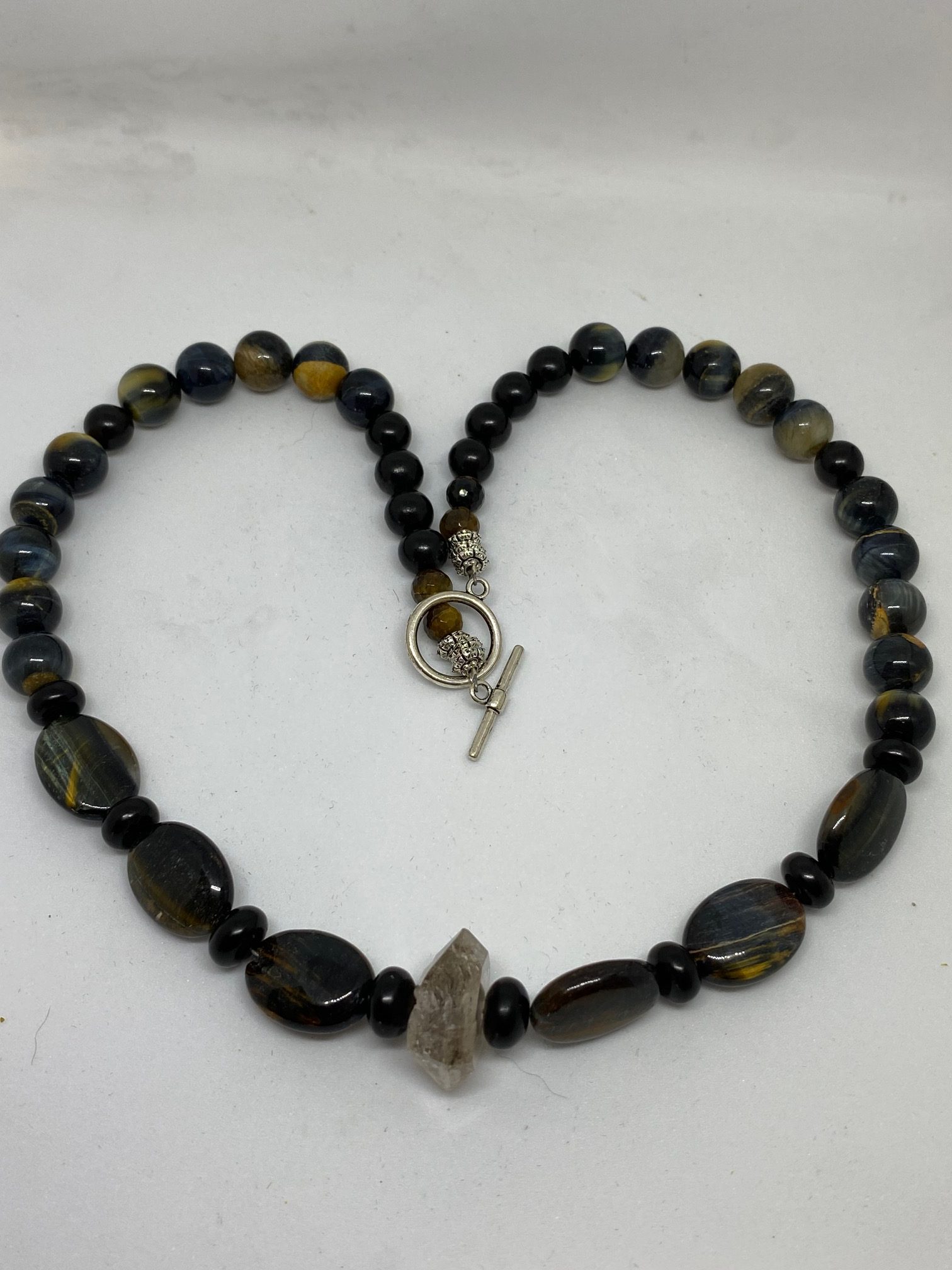 Blue Tiger Eye, Herkimer Diamond, and Jet Necklace. This necklace promotes Clear Communication, Psychic Development, and Protection. 