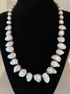 Pearl and Ruby Necklace Beautiful as it is, this necklace supports Tranquility and Courage. 