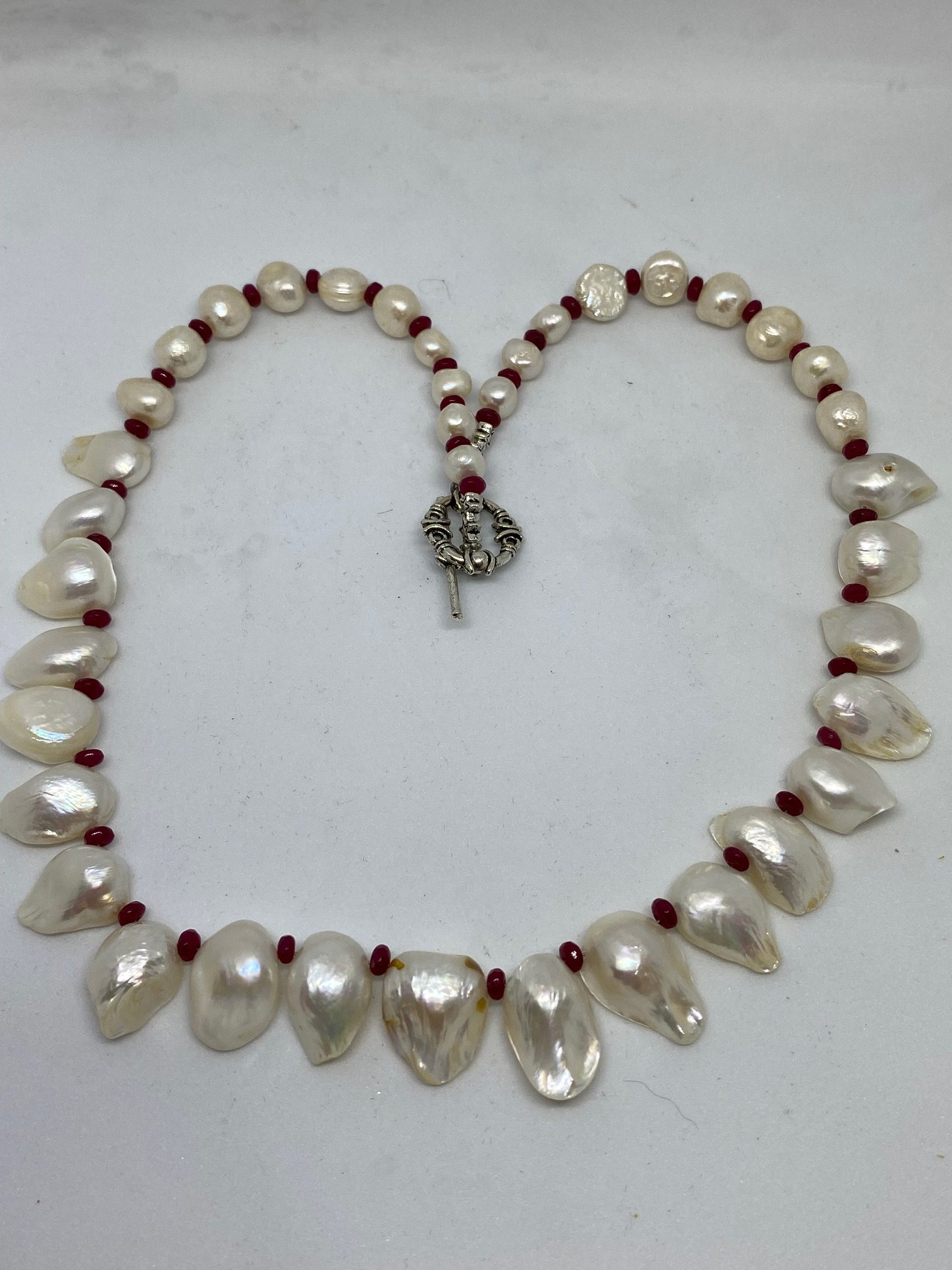 Pearl and Ruby Necklace Beautiful as it is, this necklace supports Tranquility and Courage. 