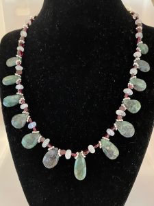 Emerald, Moonstone, and Garnet Necklace

This necklace supports Success, Good Fortune, and Protection.
