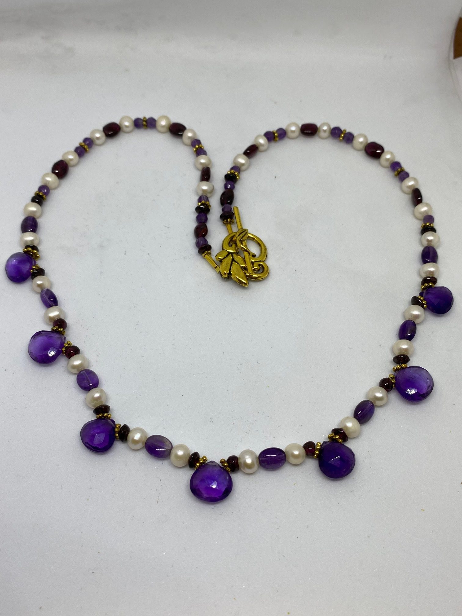 Amethyst and Pearl Necklace This necklace supports Focus, Intuition, and Integrity.
