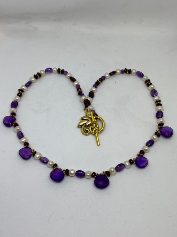 Amethyst and Pearl Necklace This necklace supports Focus, Intuition, and Integrity.