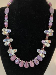 Lepidolite, Swarovski Crystal, and Garnet Necklace

This necklace supports Serenity, Prosperity, and Joy.
