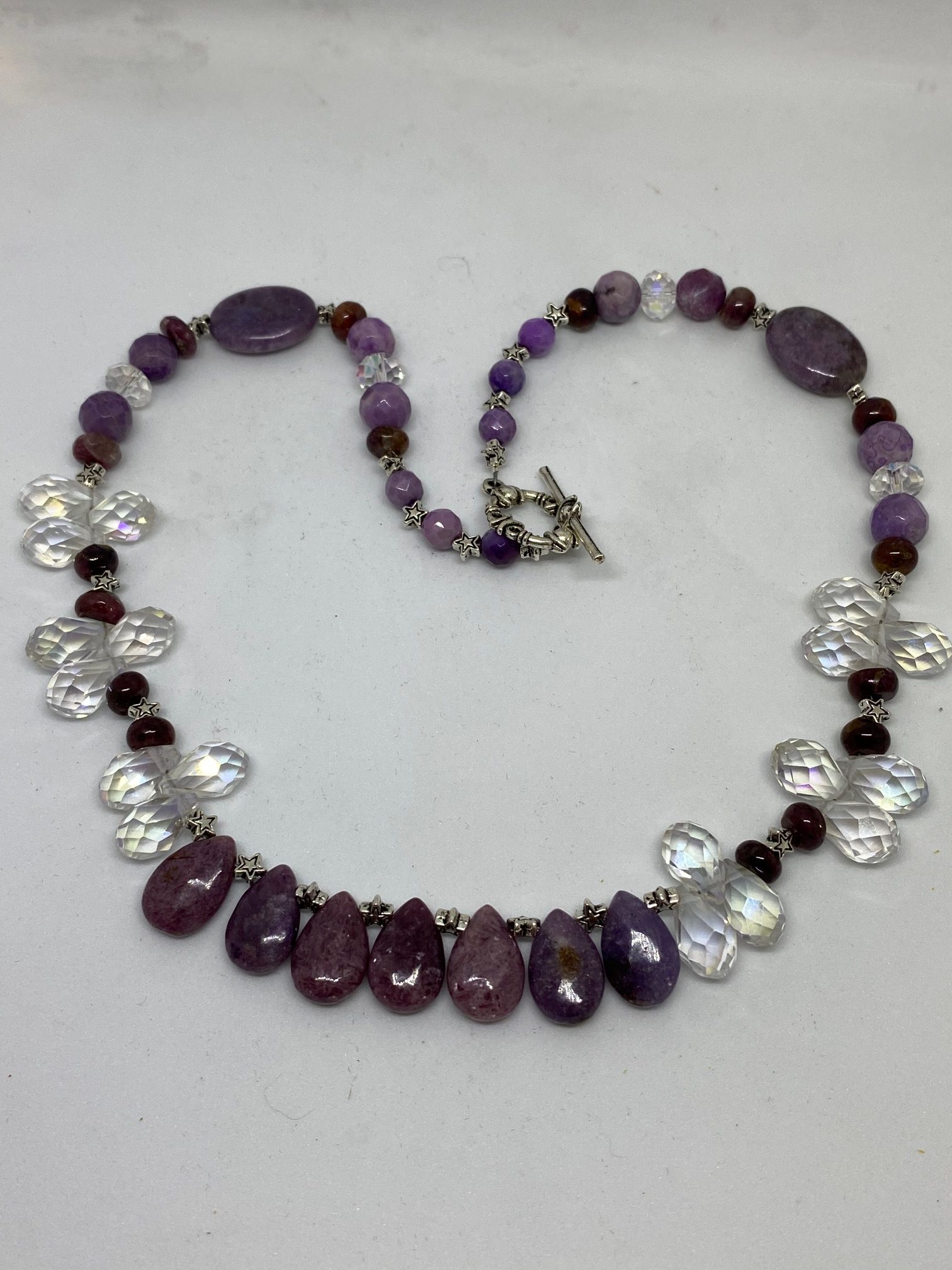 Lepidolite, Swarovski Crystal, and Garnet Necklace This necklace supports Serenity, Prosperity, and Joy.