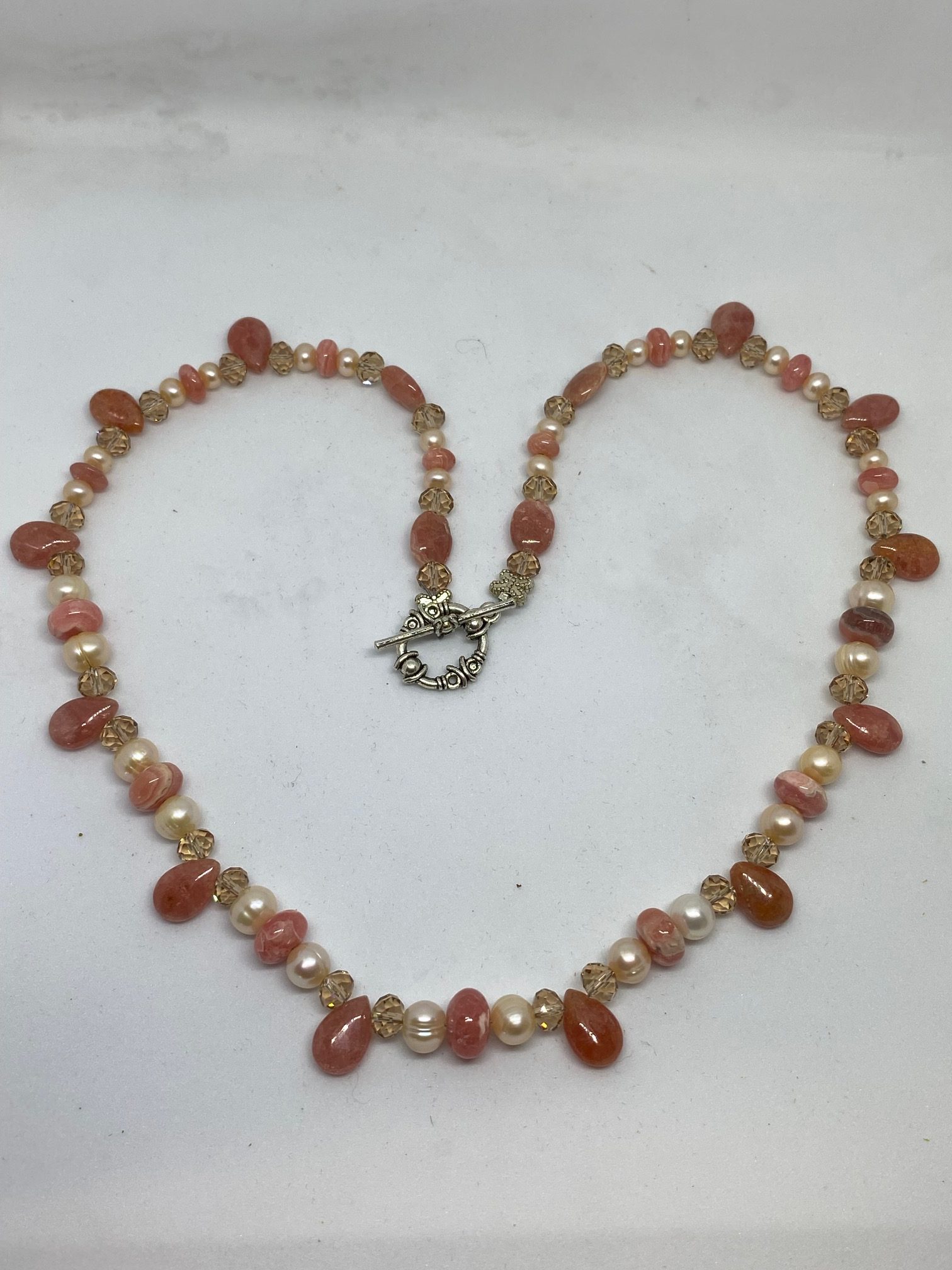 Rhodochrosite, Pearl, and Swarovski Crystal Necklace This necklace supports Joy and Tranquility