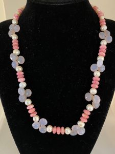 Rhodochrosite, Pearl, and Blue Chalcedony Necklace

This necklace supports Joy, Integrity, and Goodwill. 